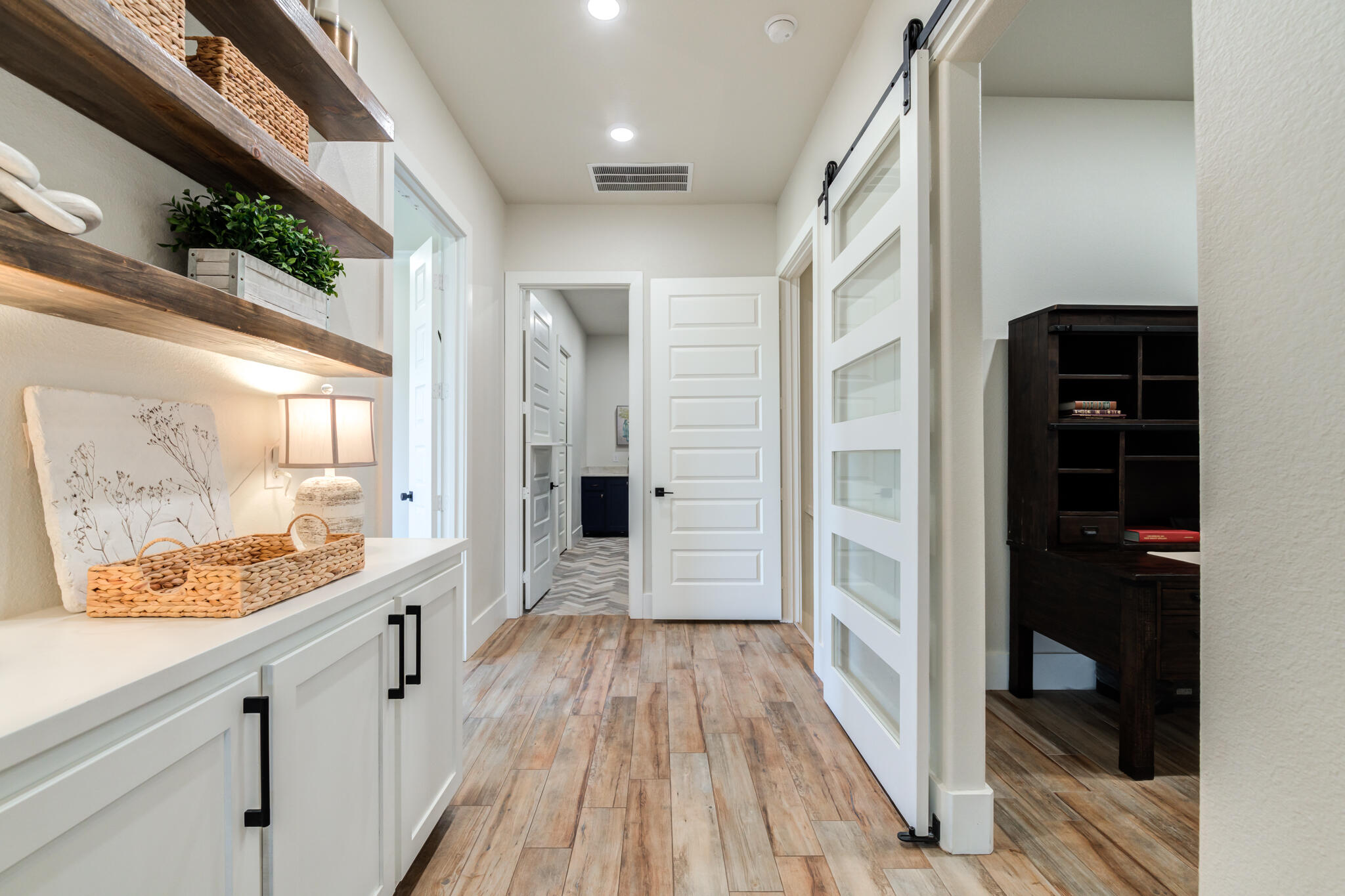 4801 118th Street Lubbock, TX 79424 - Photo 55 of 74 a view of a hallway view with wooden floor and stainless steel appliances