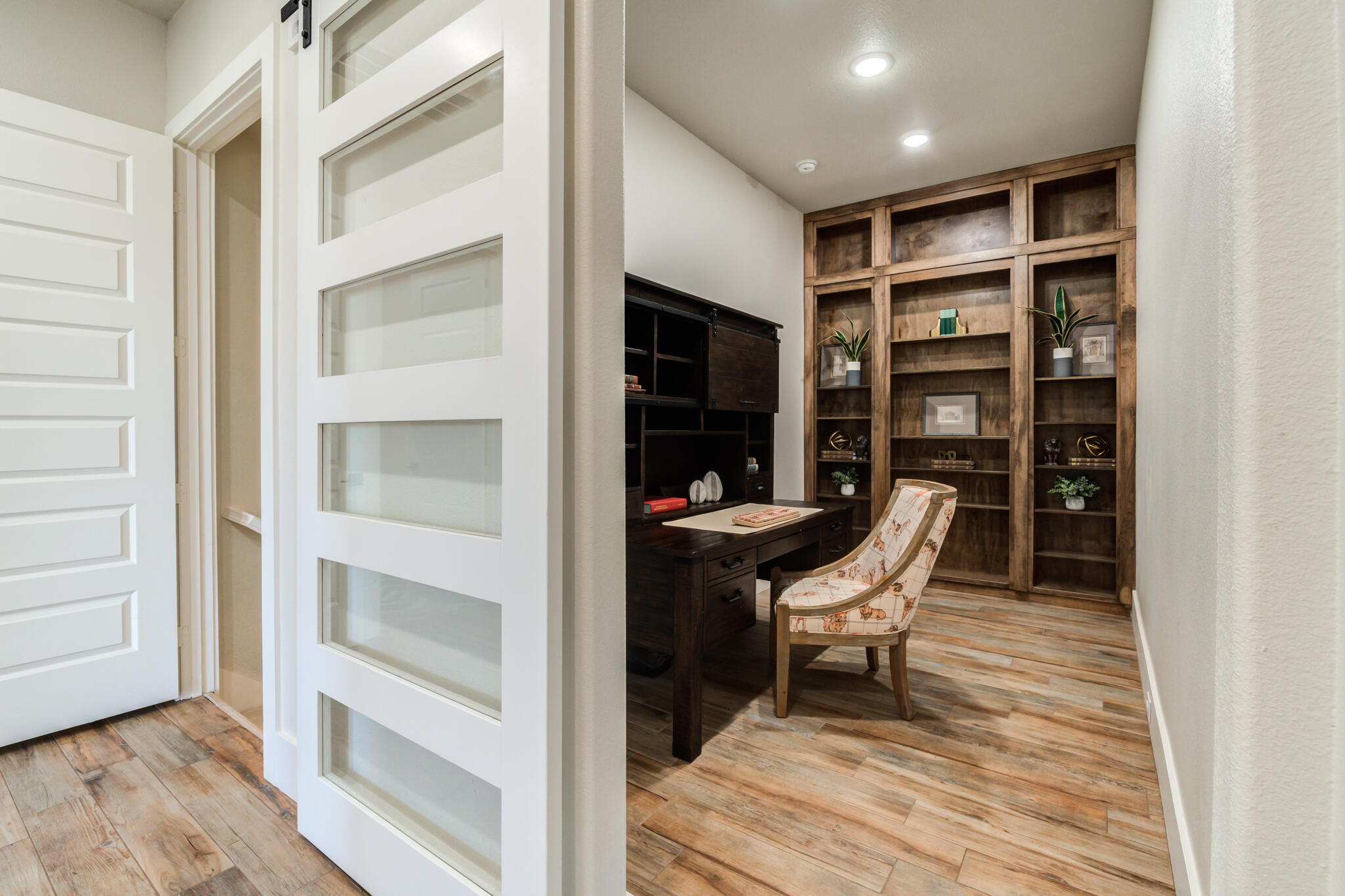 4801 118th Street Lubbock, TX 79424 - Photo 57 of 74 a room with furniture and wooden floor