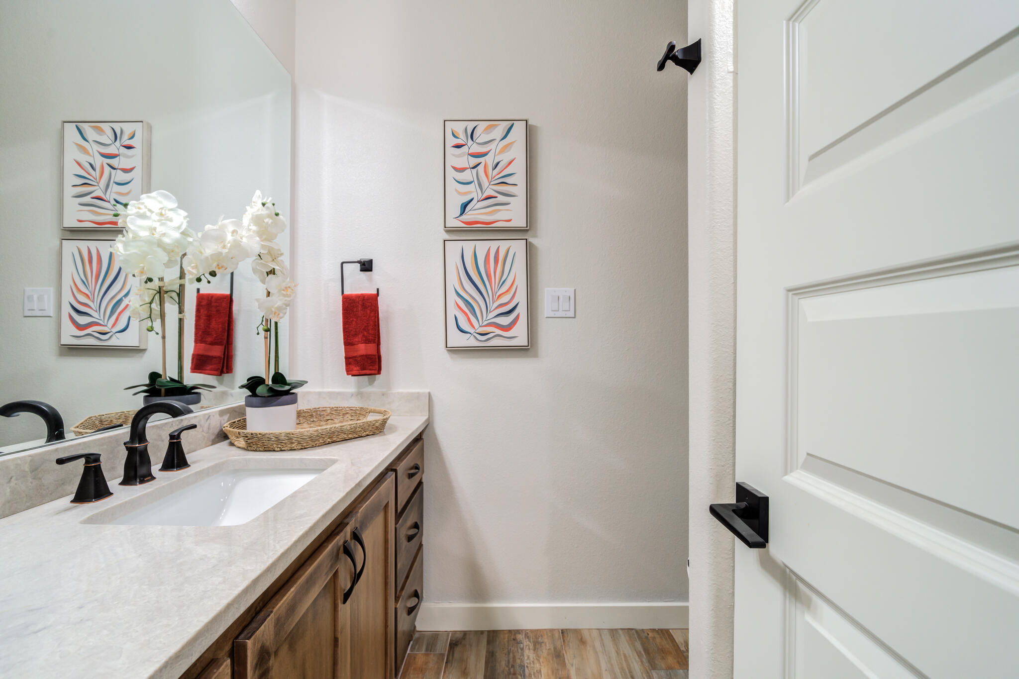 4801 118th Street Lubbock, TX 79424 - Photo 65 of 74 a bathroom with a sink a vanity and a mirror