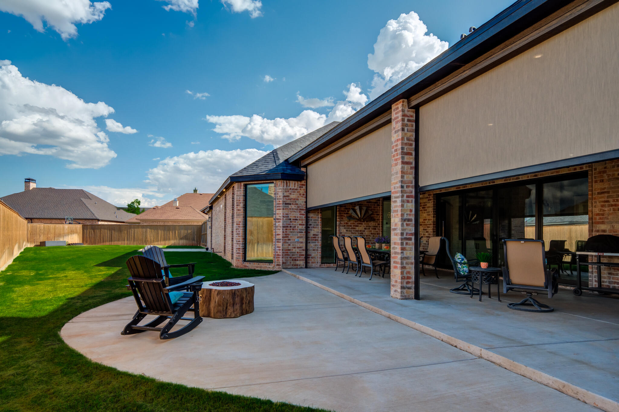 4801 118th Street Lubbock, TX 79424 - Photo 71 of 74 a view of a patio with table and chairs potted plants and a large tree