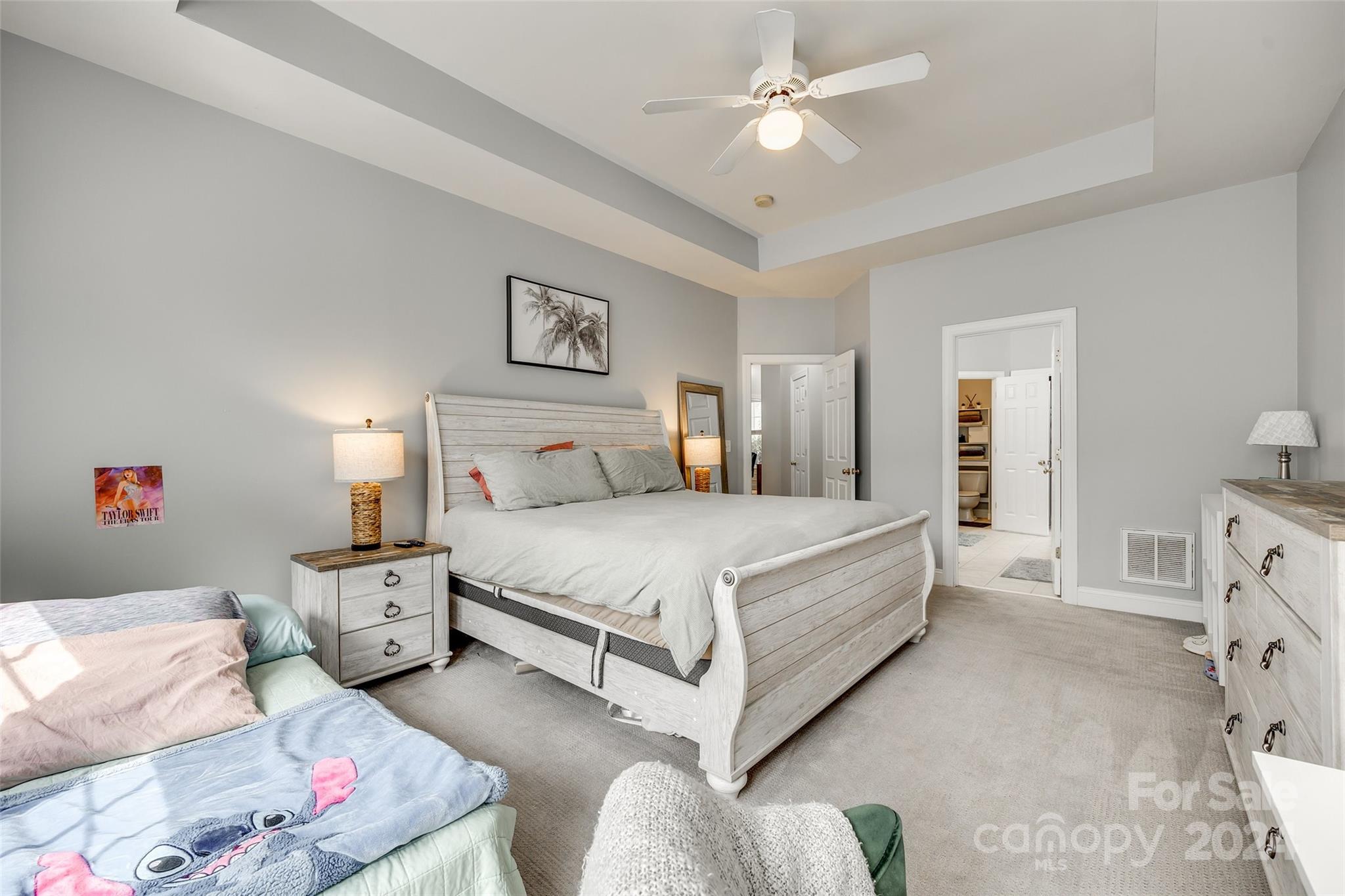 2008 Emerald Pines Drive Tega Cay, SC 29708 - Photo 14 of 48 a spacious bedroom with a bed and a ceiling fan