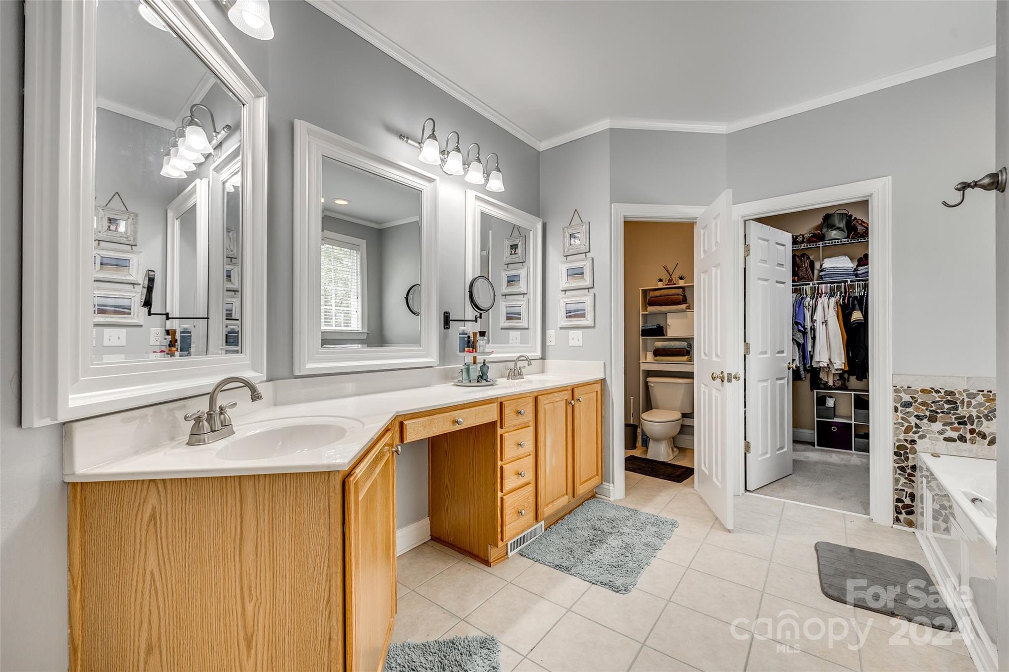 2008 Emerald Pines Drive Tega Cay, SC 29708 - Photo 15 of 48 a spacious bathroom with a sink double vanity and a mirror