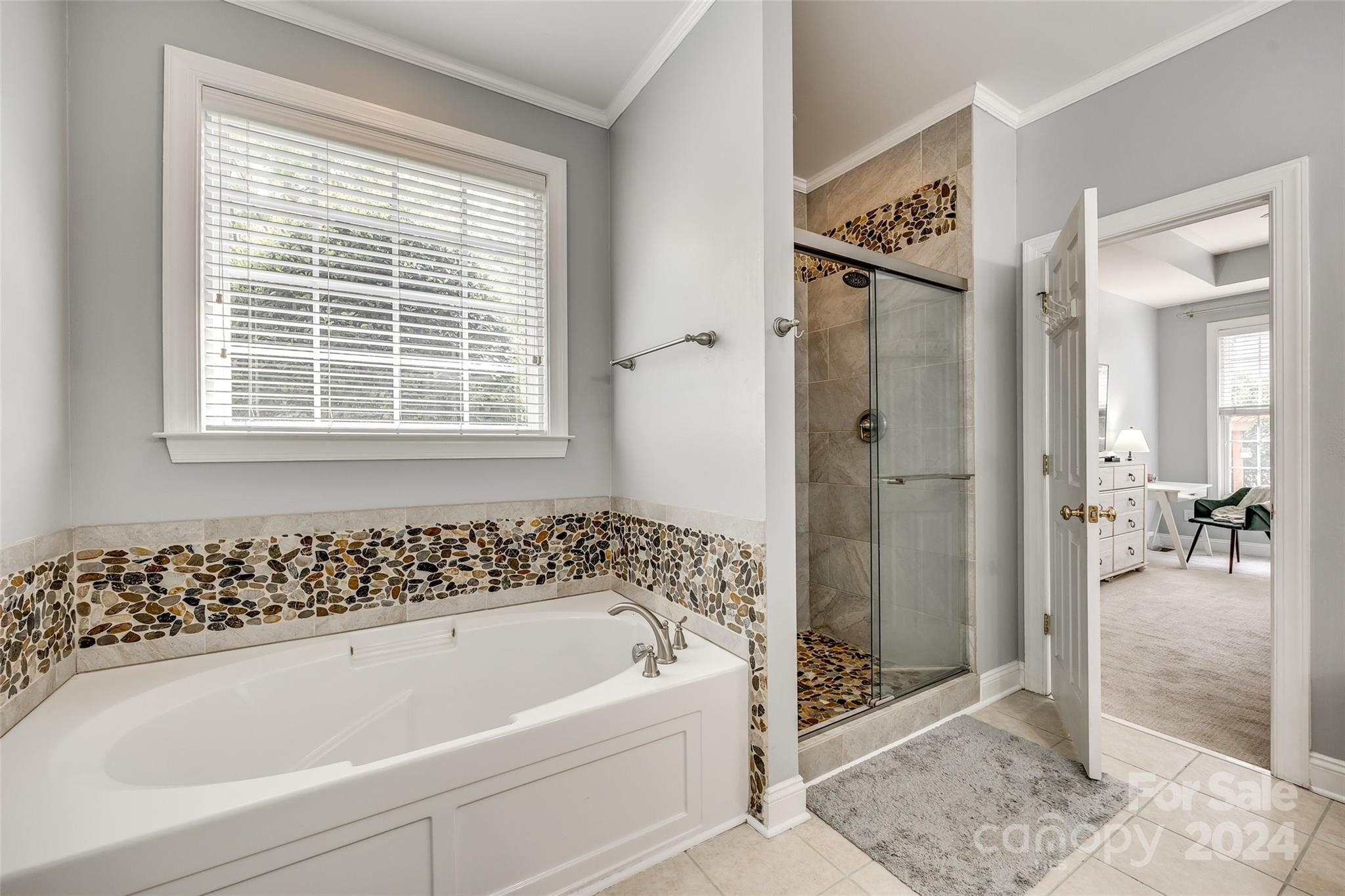 2008 Emerald Pines Drive Tega Cay, SC 29708 - Photo 16 of 48 a bathroom with a bathtub and a shower