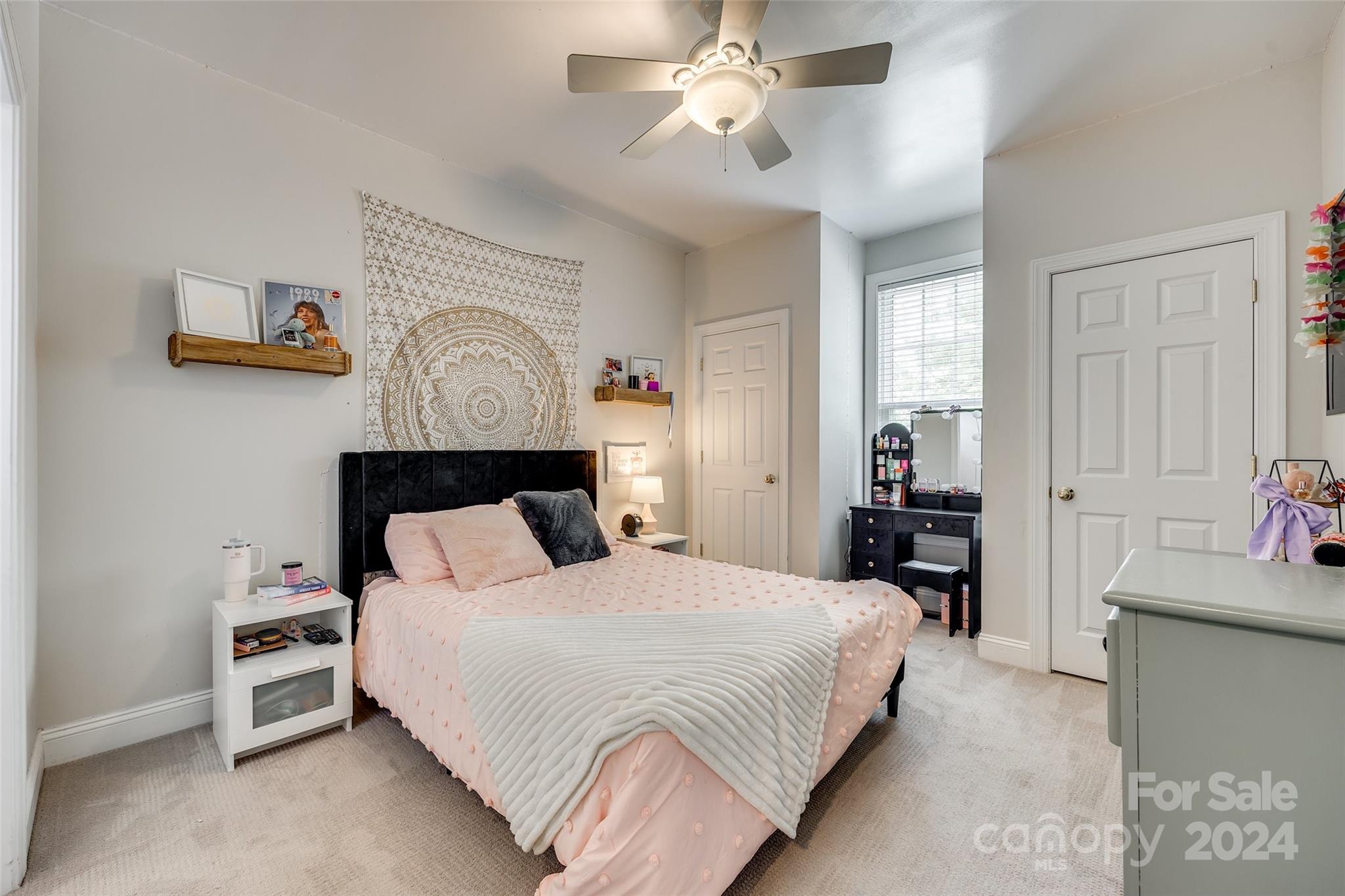 2008 Emerald Pines Drive Tega Cay, SC 29708 - Photo 18 of 48 a bedroom with a bed and a chandelier