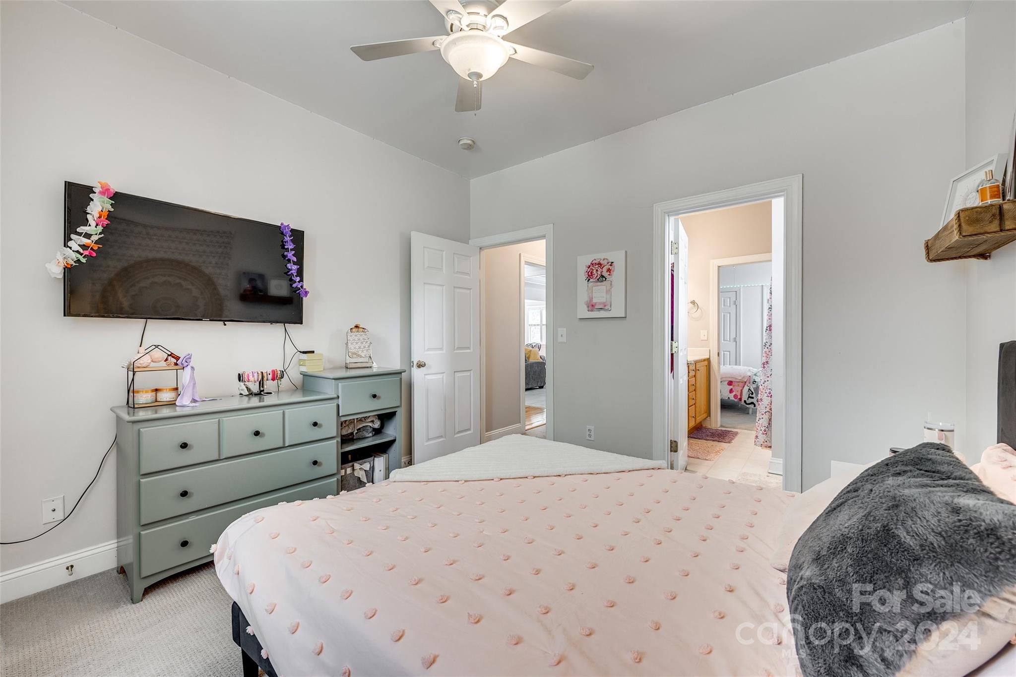2008 Emerald Pines Drive Tega Cay, SC 29708 - Photo 19 of 48 a bedroom with a bed and a flat screen tv
