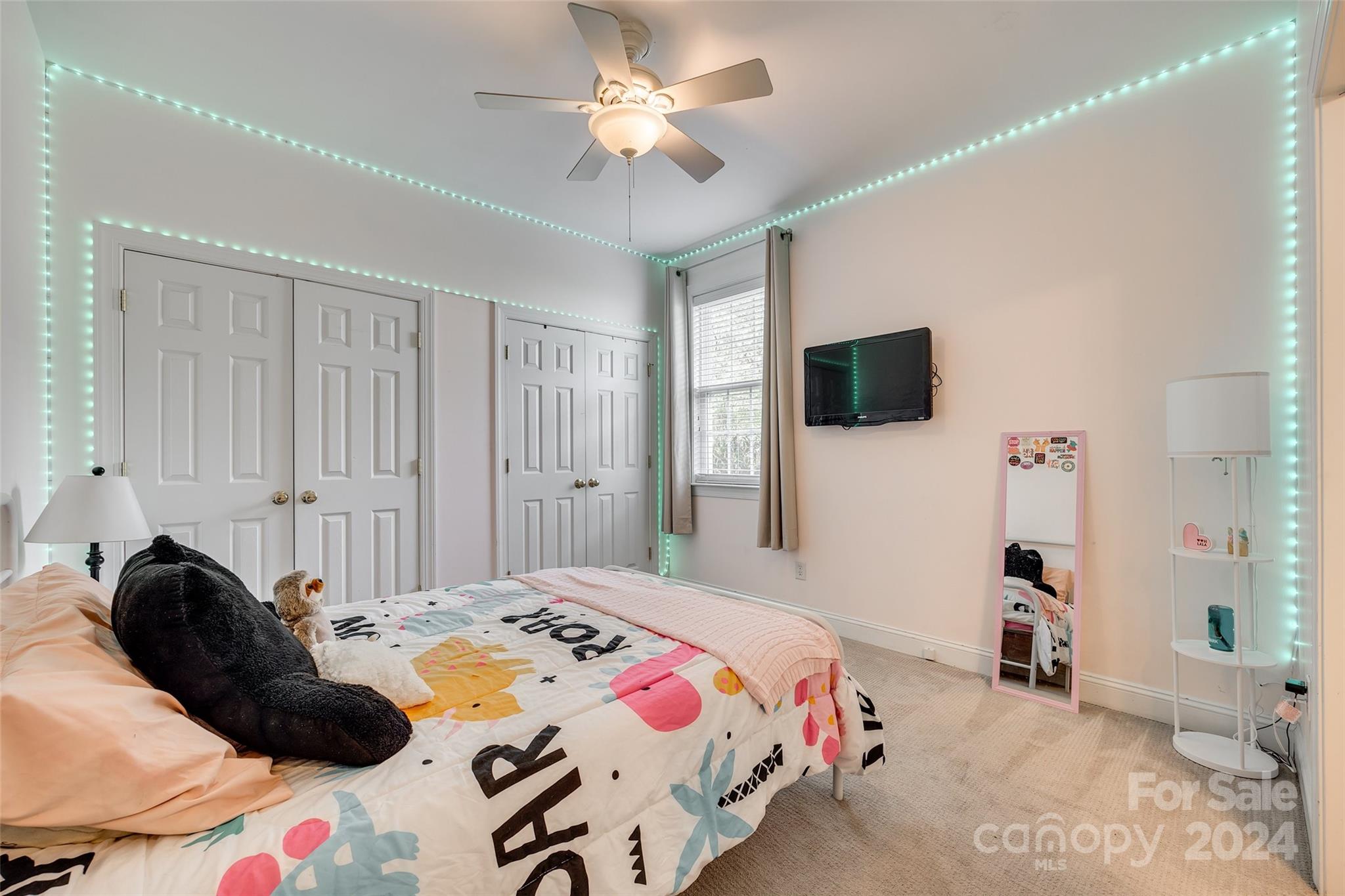 2008 Emerald Pines Drive Tega Cay, SC 29708 - Photo 20 of 48 a bedroom with a bed and a flat tv screen