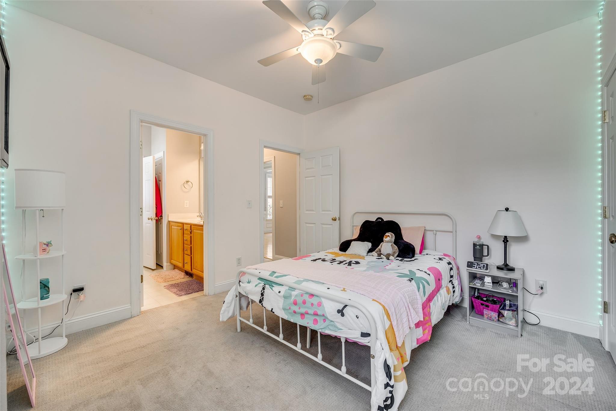 2008 Emerald Pines Drive Tega Cay, SC 29708 - Photo 21 of 48 a bed room with a bed and a chandelier