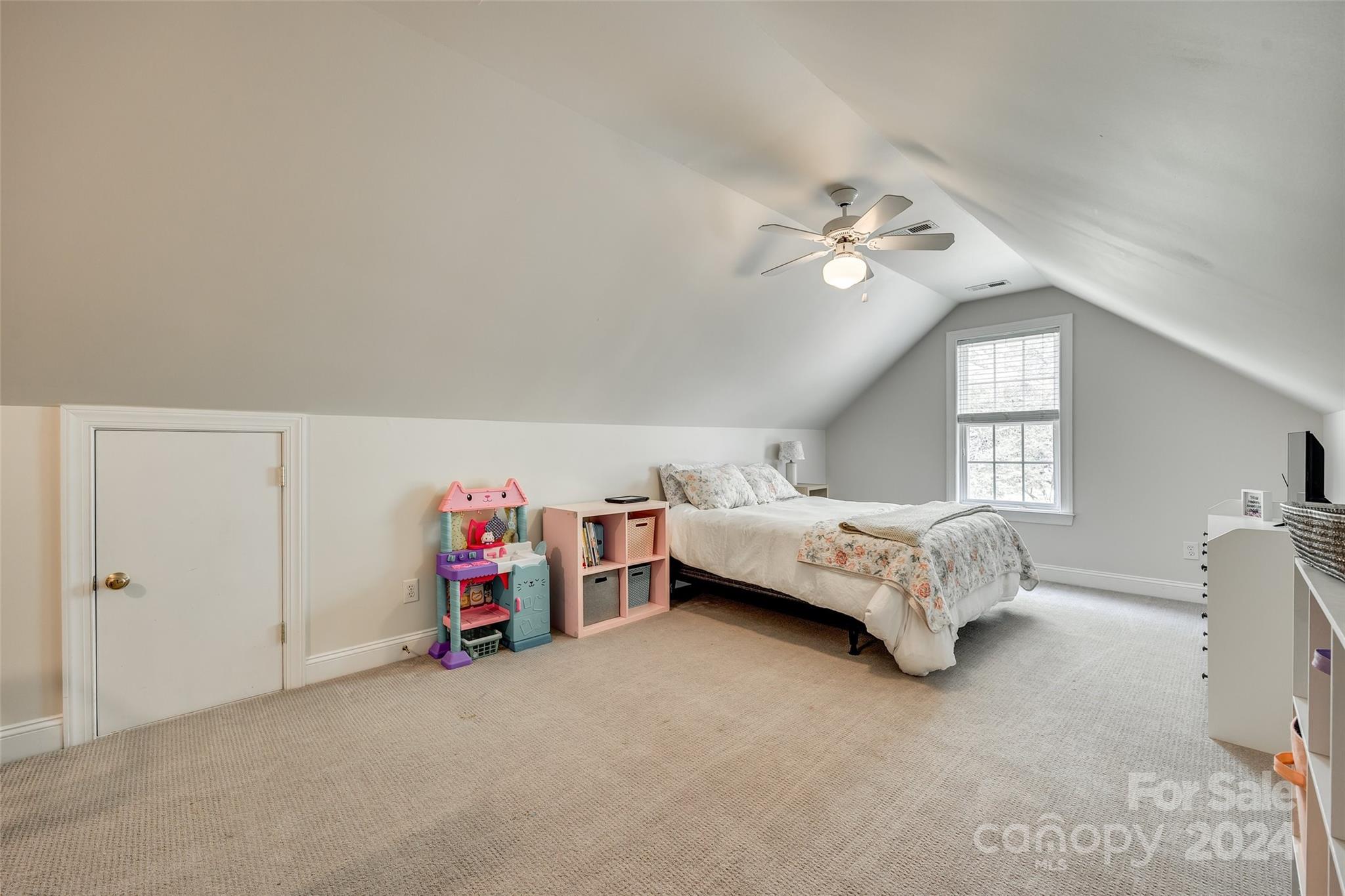 2008 Emerald Pines Drive Tega Cay, SC 29708 - Photo 26 of 48 a bedroom with a bed and a chandelier