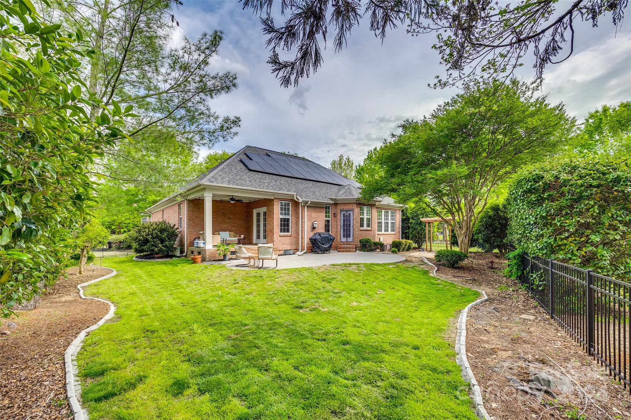 2008 Emerald Pines Drive Tega Cay, SC 29708 - Photo 28 of 48 a view of a house with a yard porch and sitting area