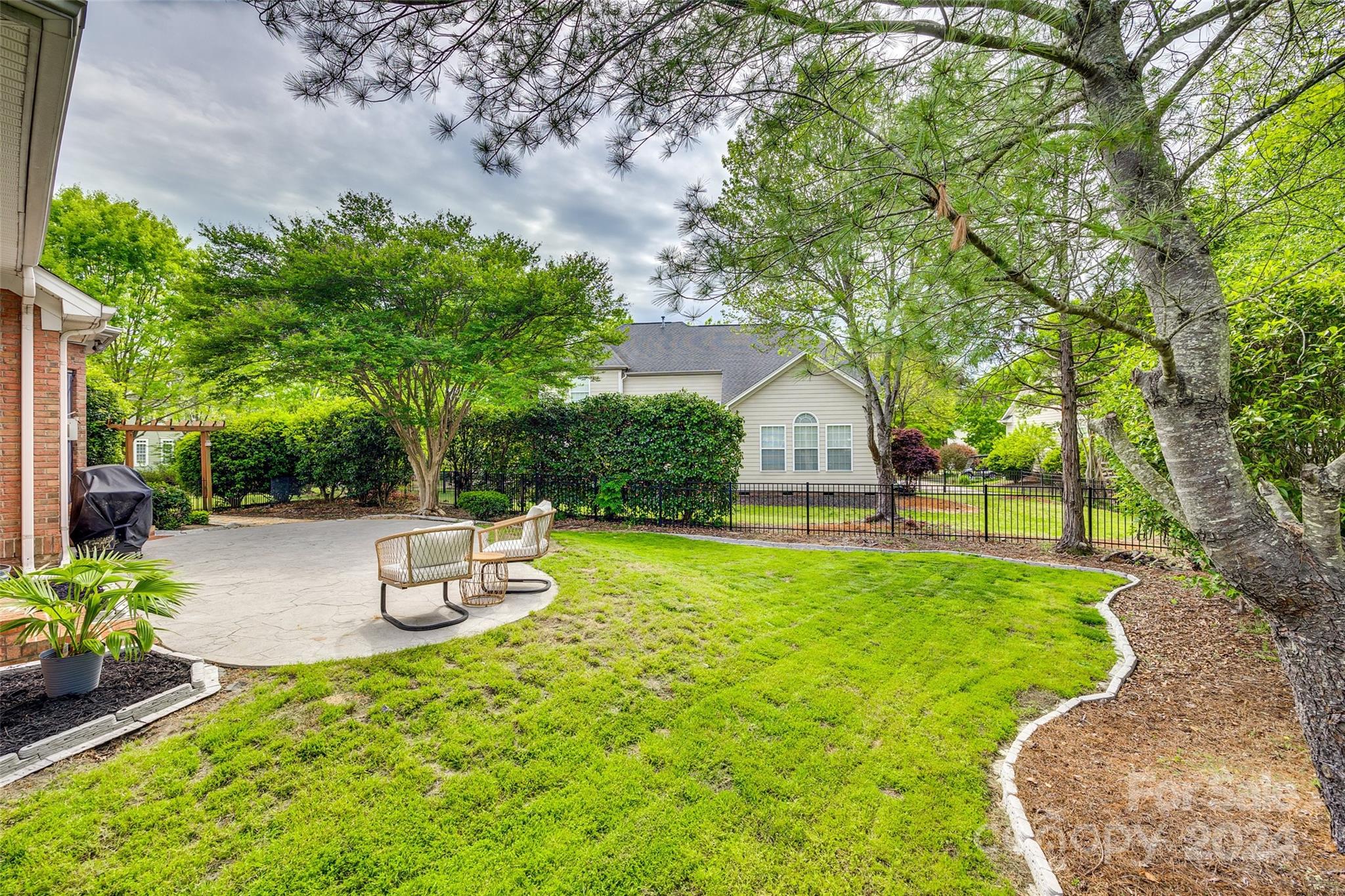 2008 Emerald Pines Drive Tega Cay, SC 29708 - Photo 29 of 48 a view of a backyard with sitting area