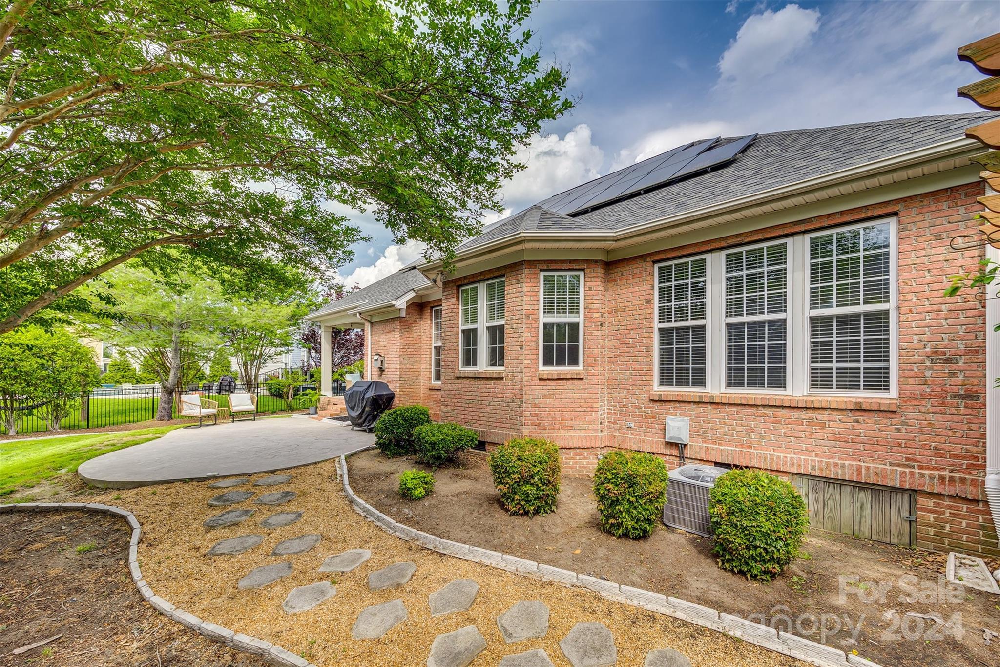 2008 Emerald Pines Drive Tega Cay, SC 29708 - Photo 30 of 48 a front view of a house with garden