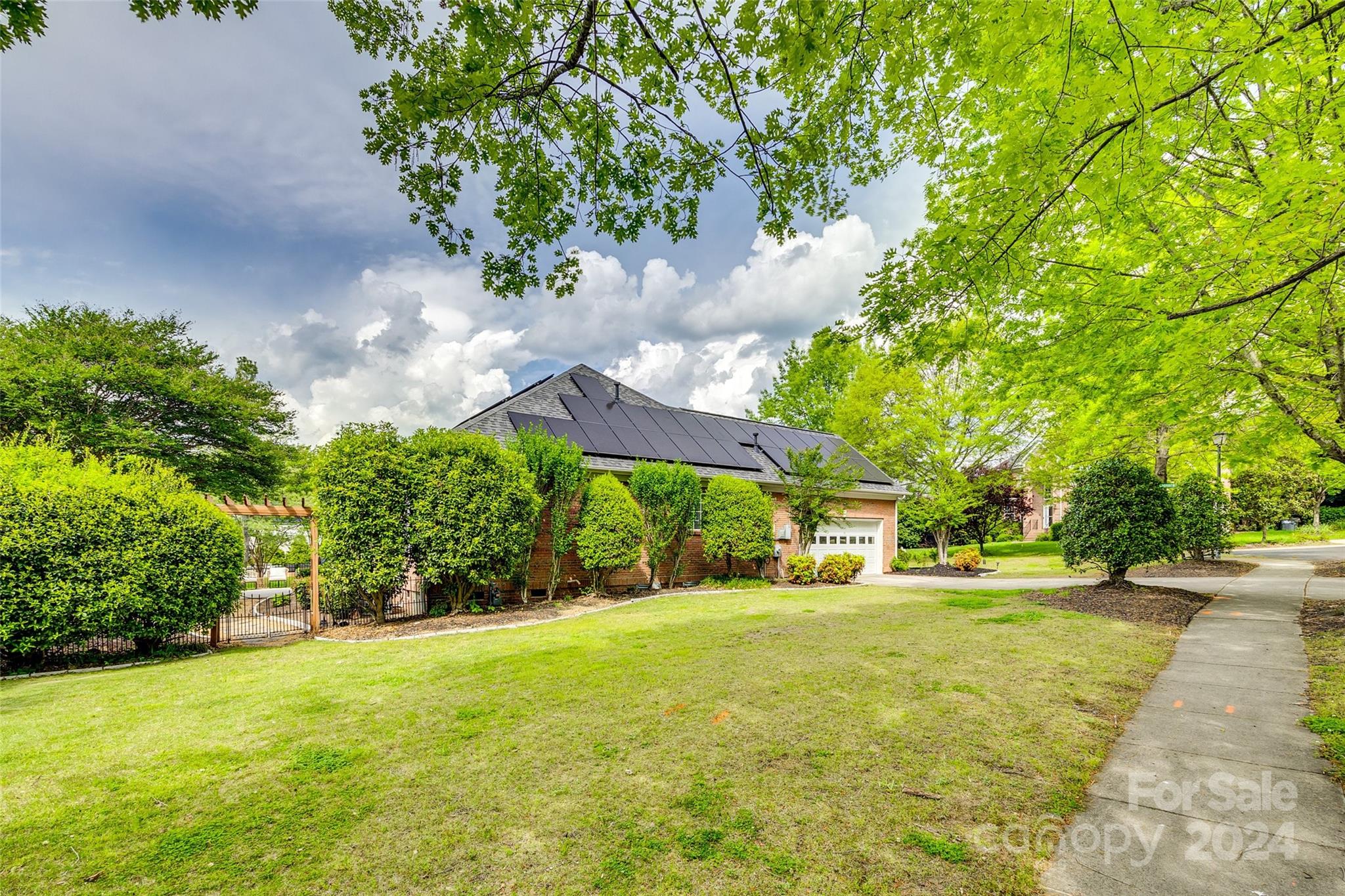 2008 Emerald Pines Drive Tega Cay, SC 29708 - Photo 31 of 48 a yellow building with trees in front of it
