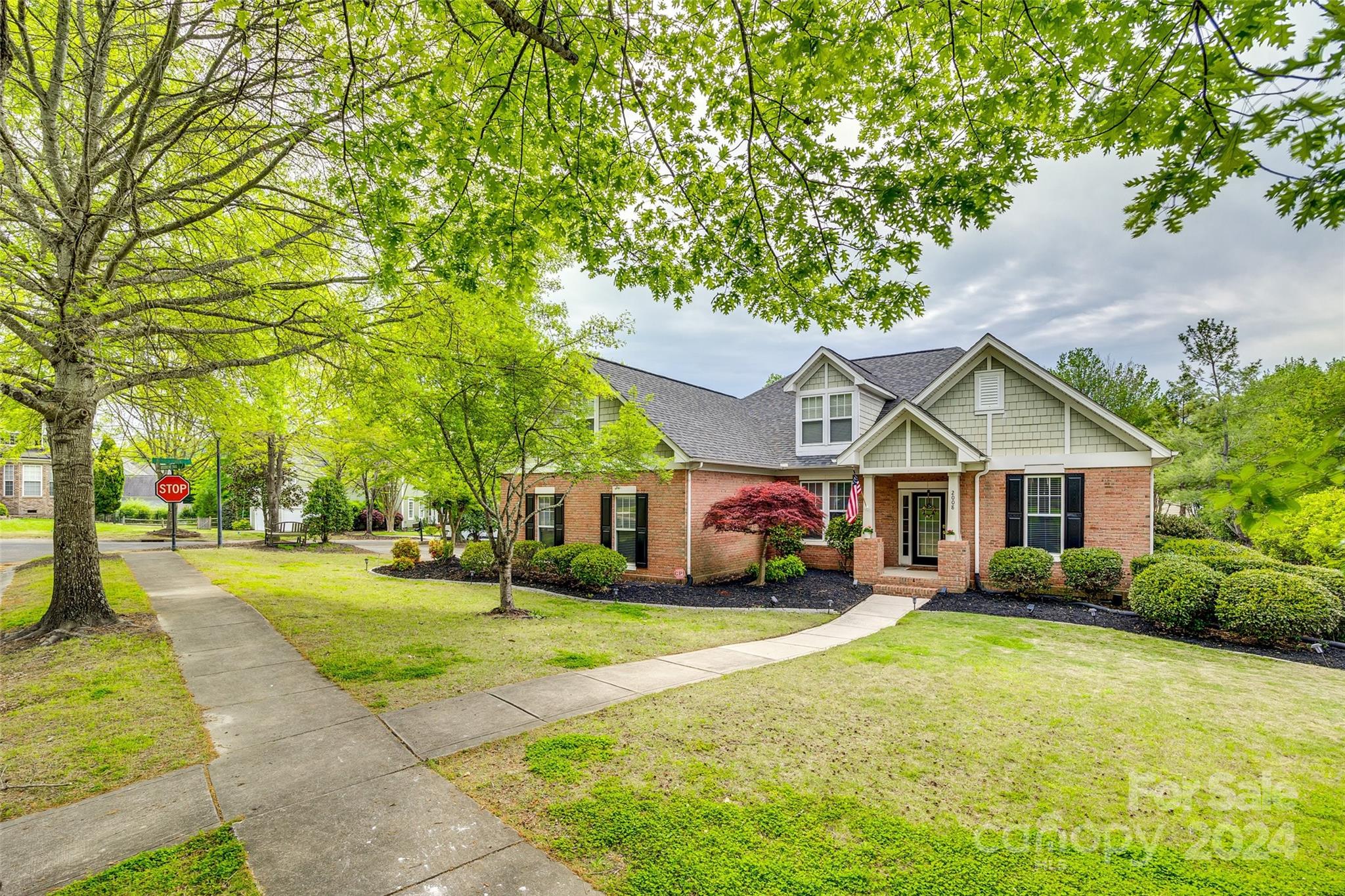 2008 Emerald Pines Drive Tega Cay, SC 29708 - Photo 32 of 48 a front view of a house with a yard and trees