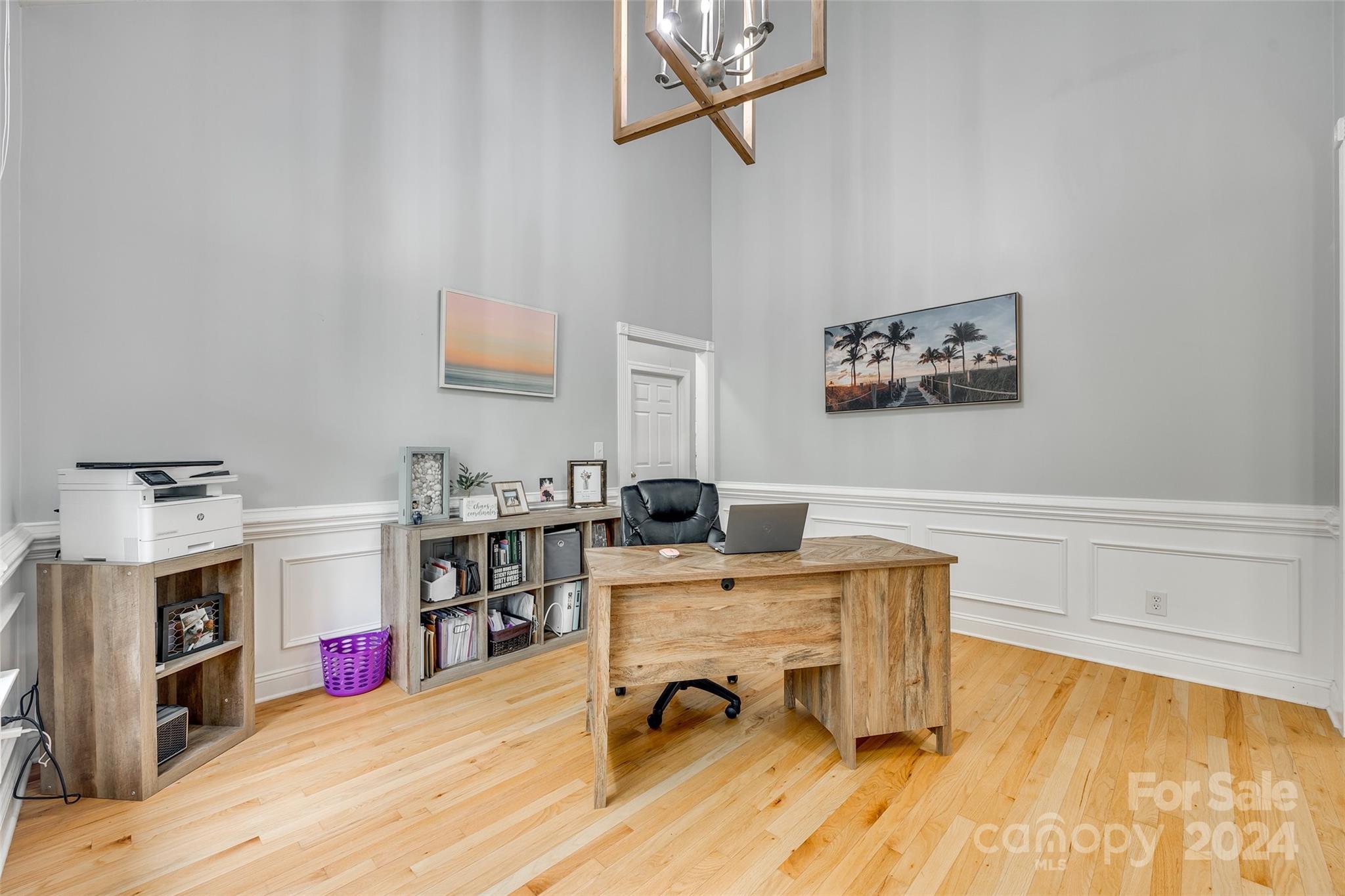 2008 Emerald Pines Drive Tega Cay, SC 29708 - Photo 4 of 48 a view of a workspace with furniture and a flat screen tv