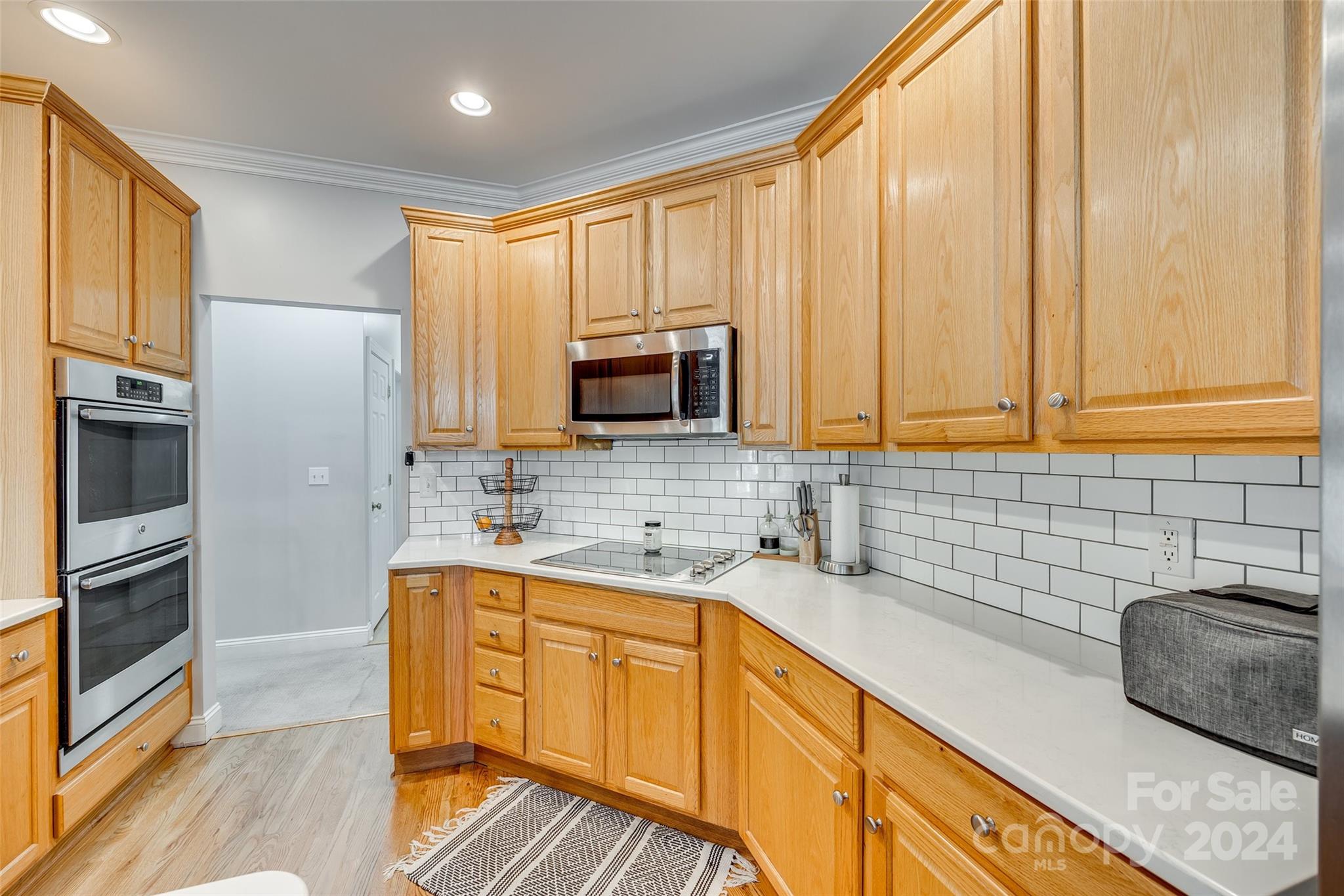 2008 Emerald Pines Drive Tega Cay, SC 29708 - Photo 10 of 48 a kitchen with stainless steel appliances granite countertop a sink a stove and cabinets
