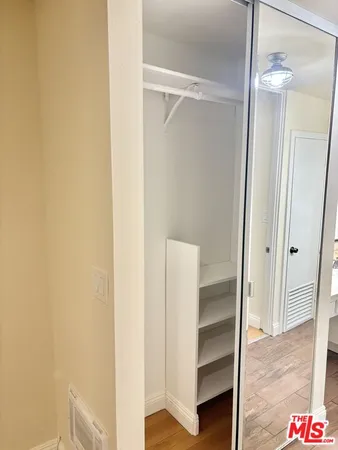 a view of an empty walk in closet