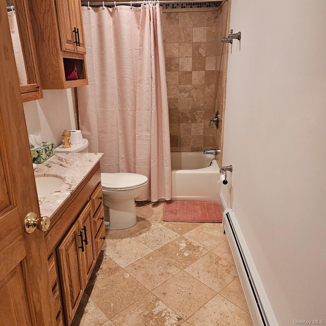 28 Cardinal Drive Poughkeepsie, NY 12601 - Photo 16 of 20 a bathroom with a sink a toilet and shower