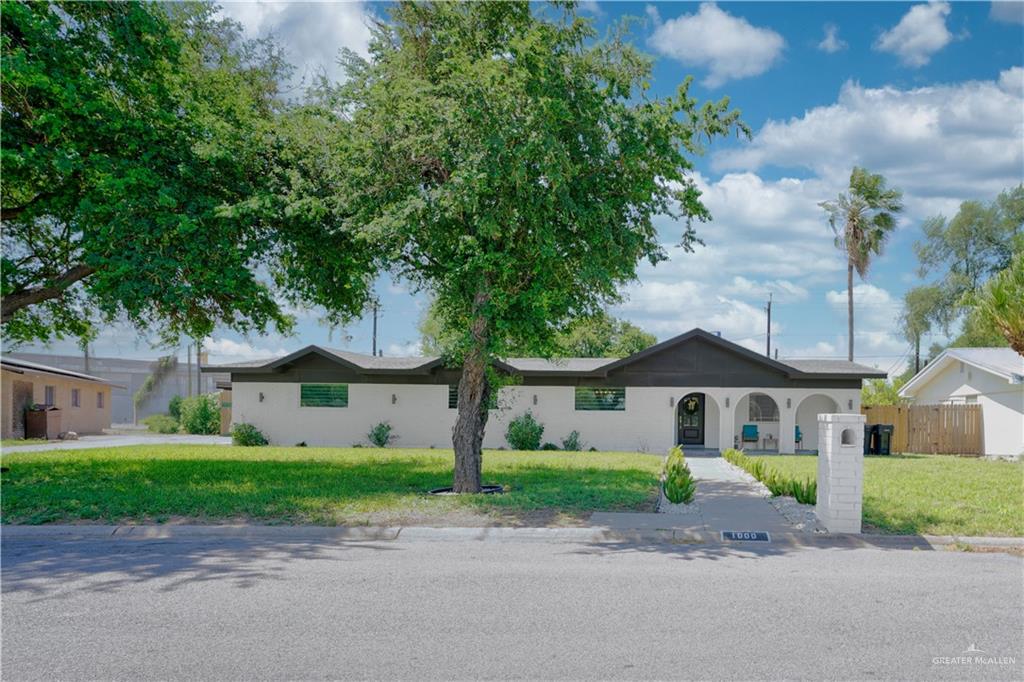 1000 East Ithaca Avenue McAllen, TX 78501 - Photo 1 of 29 a front view of house with yard and green space