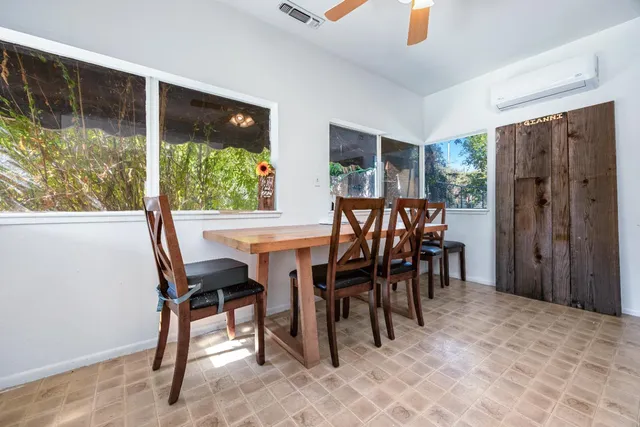 a view of walk in closet with window and washer