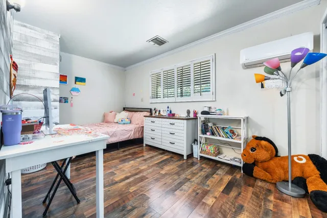 a view of a house with a wooden fence