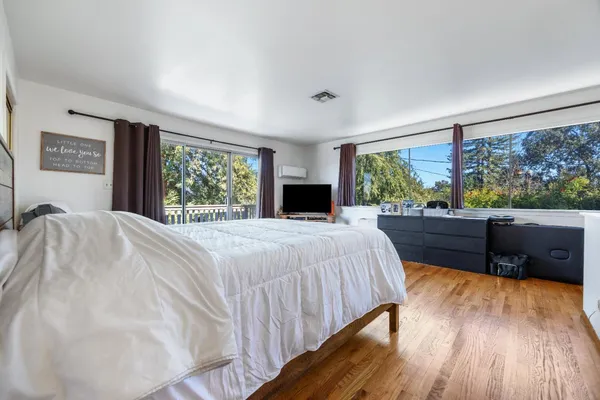 a white bath tub sitting next to a white toilet