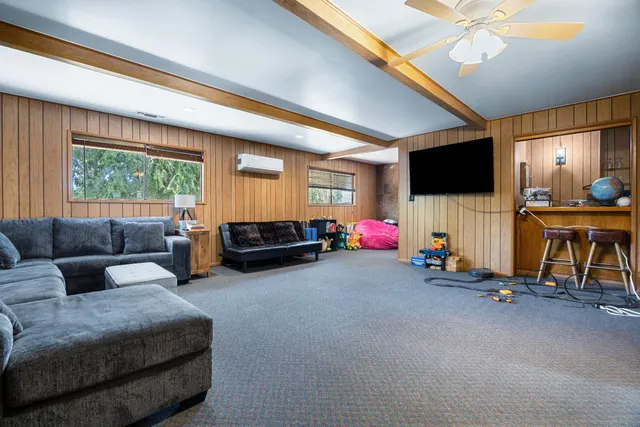 a kitchen with refrigerator and cabinets