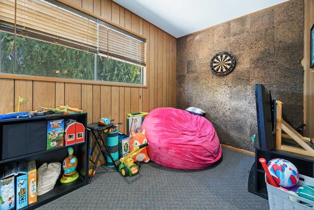 a view of a dining room with furniture window and outside view