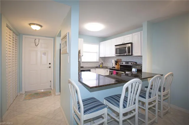 a kitchen with granite countertop kitchen island granite countertop a sink and granite counter tops