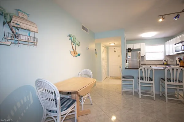 a view of a dining room with furniture