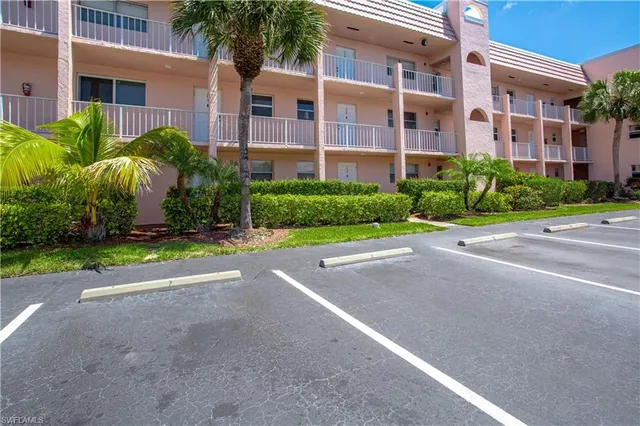 a view of a building with a yard