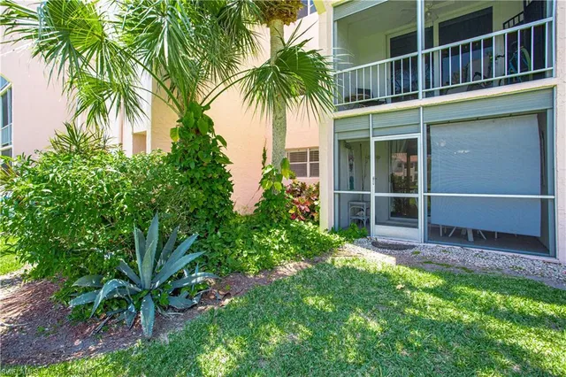 a view of a garden with a house