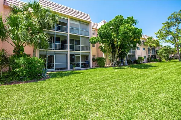 a view of house with yard