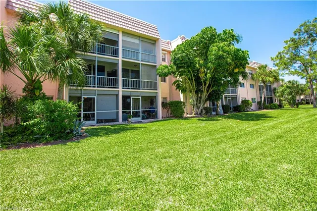 a view of house with yard
