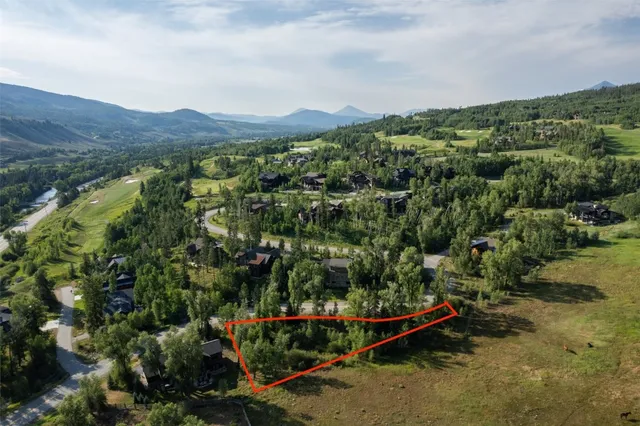 a view of a city with mountains in the background