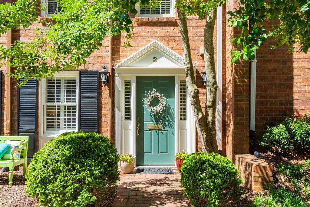 4620 Wieuca Road Northeast, Unit 2 Atlanta, GA 30342 - Photo 1 of 1 a front view of a house with a yard