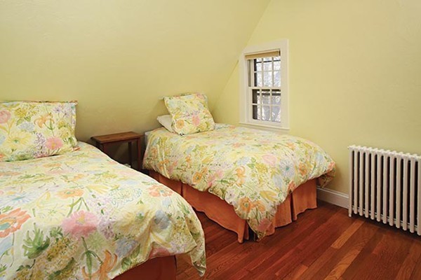 133 Collins Road Newton, MA 02468 - Photo 11 of 15 a bedroom with two beds and wooden floor