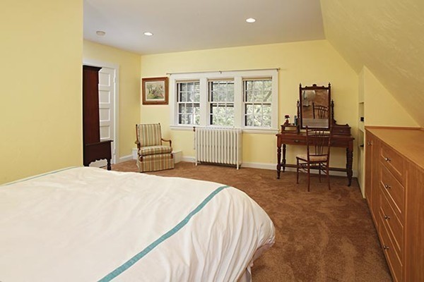 133 Collins Road Newton, MA 02468 - Photo 12 of 15 a living room with furniture and a table