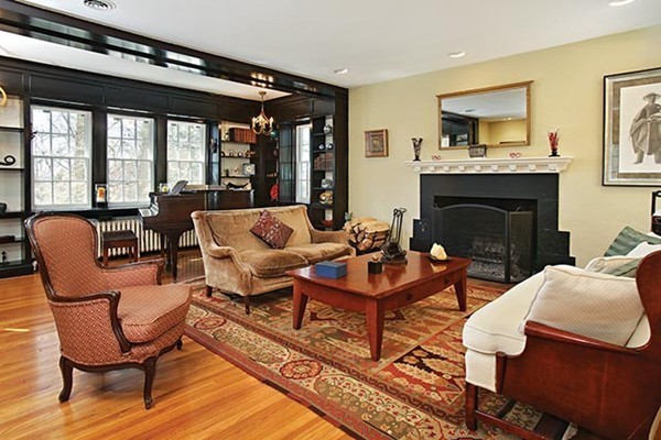 133 Collins Road Newton, MA 02468 - Photo 2 of 15 a living room with furniture and a fireplace