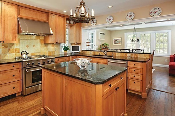 133 Collins Road Newton, MA 02468 - Photo 4 of 15 a kitchen with stainless steel appliances granite countertop a sink a stove and a wooden floors