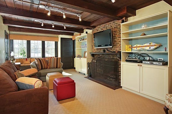 133 Collins Road Newton, MA 02468 - Photo 6 of 15 a living room with furniture and a flat screen tv