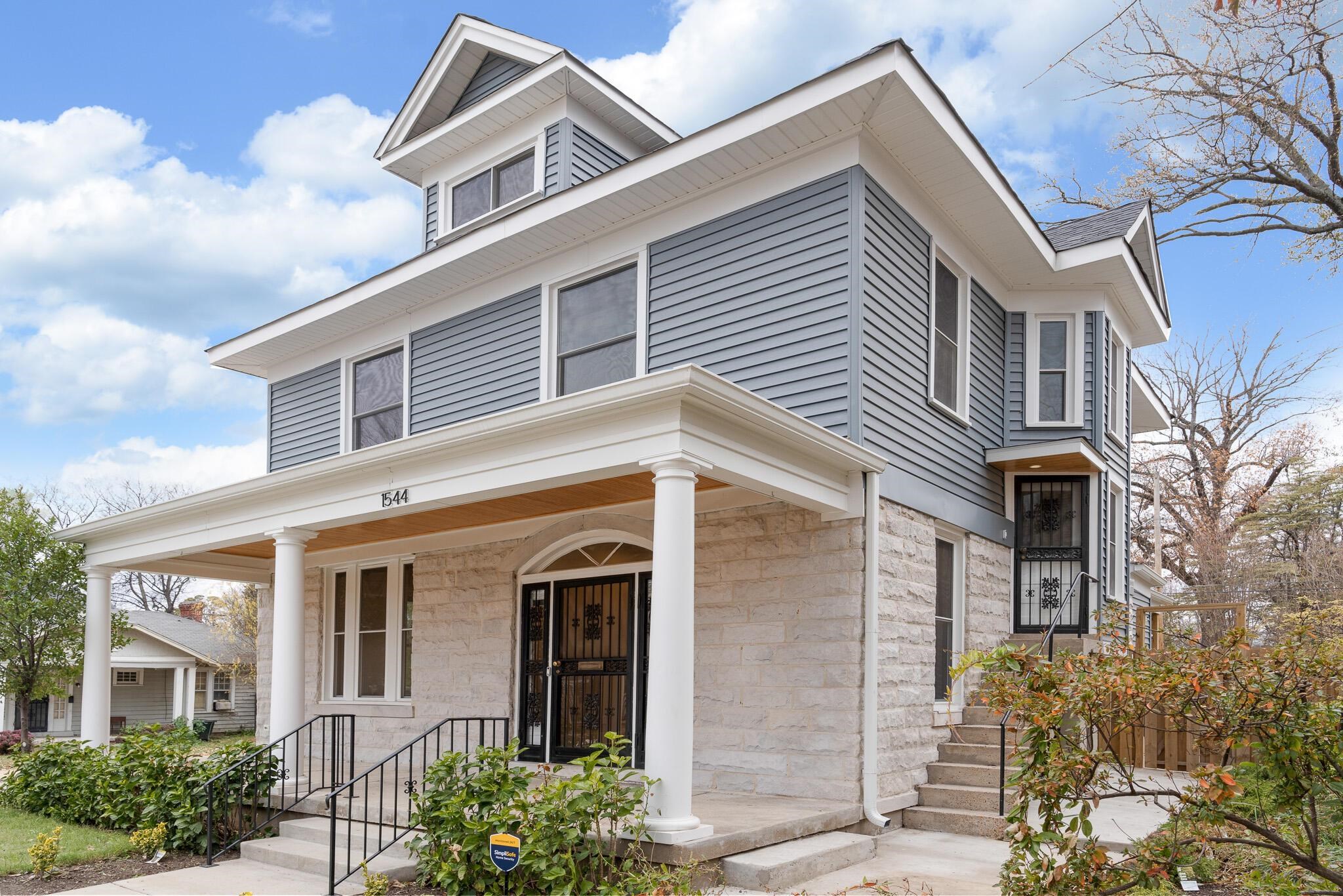 1544 Court Avenue, Unit 1 Memphis, TN 38104 - Photo 1 of 36 a front view of a house with a garden