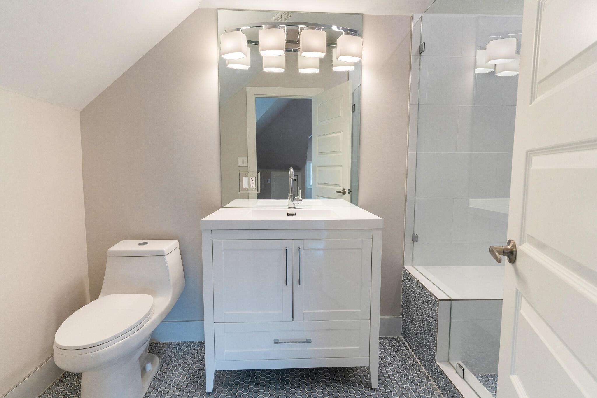 1544 Court Avenue, Unit 1 Memphis, TN 38104 - Photo 16 of 36 a bathroom with a toilet sink and mirror