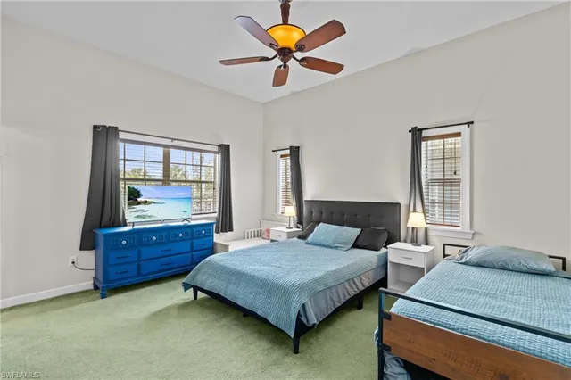 a bathroom with a toilet window and a shower