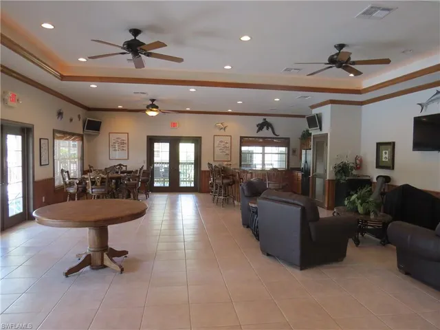 a view of a livingroom with furniture and a ceiling fan