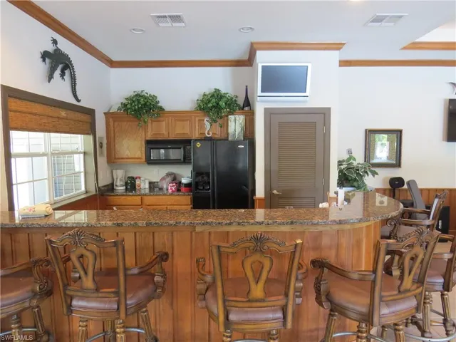 a dining table & chairs in a room