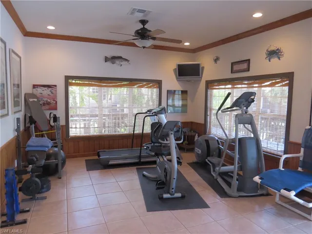 a room with gym equipment and a large window