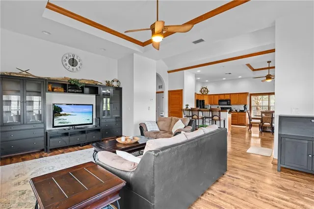 a living room with fireplace furniture and a wooden floor