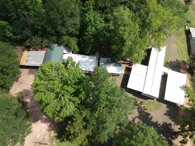 an aerial view of a house with outdoor space