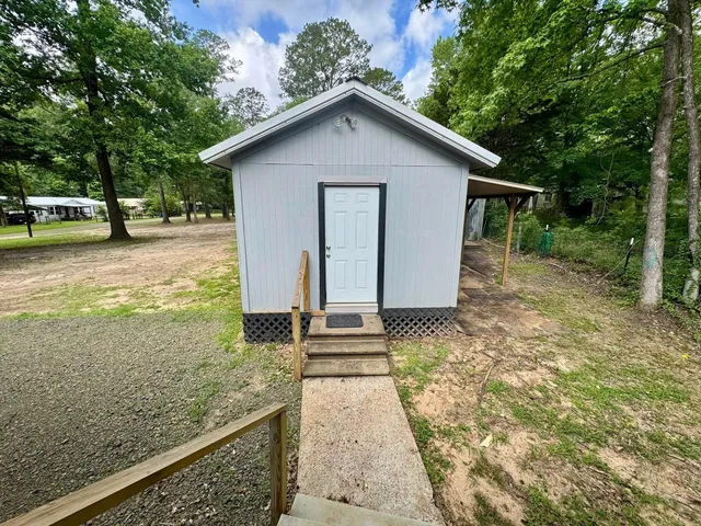 a backyard of a house with lots of green space