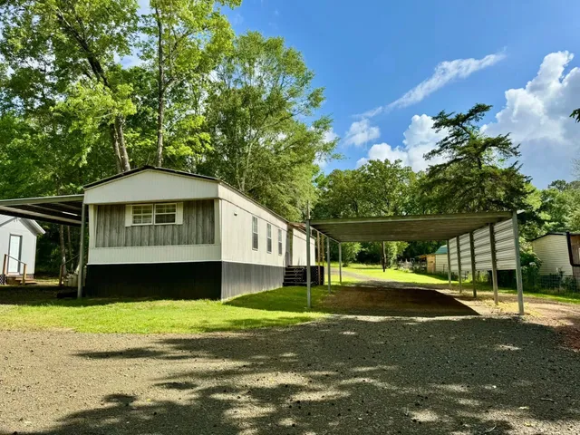 a house with trees in the background